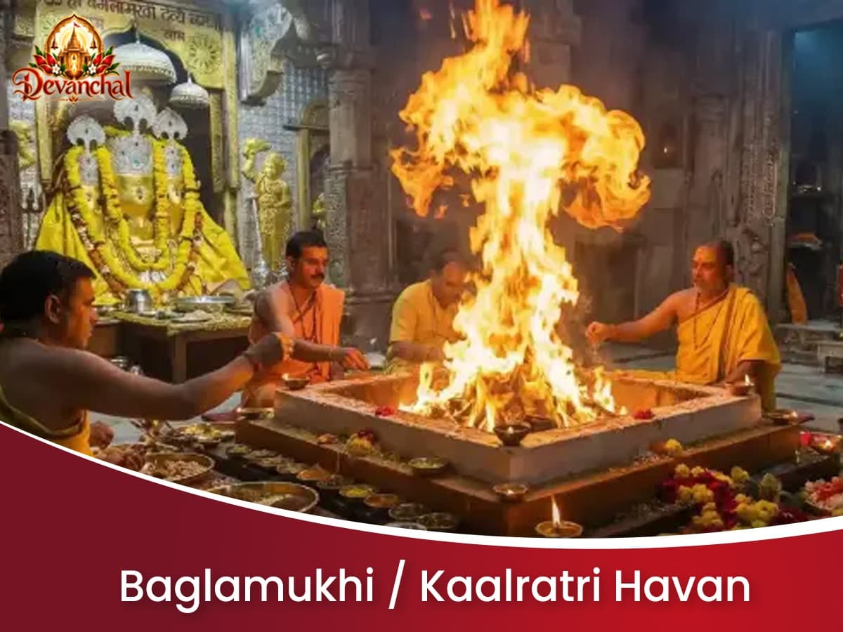 Priests conducting a pooja around a sacred fire in a temple