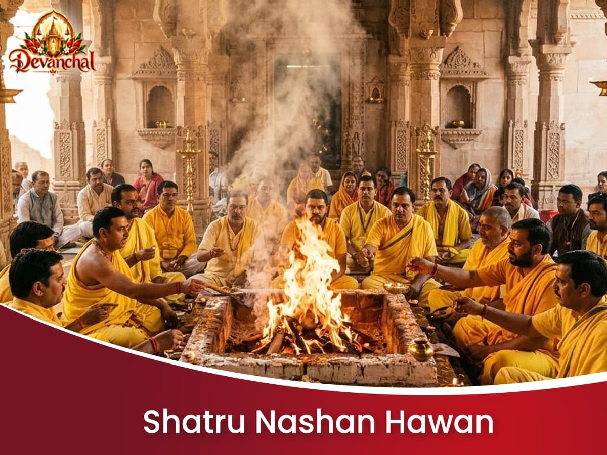 Priests conducting a pooja around a sacred fire in a temple